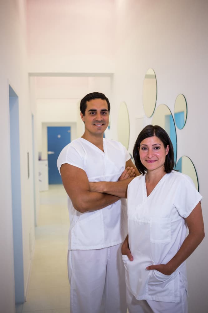 portrait-male-female-dentist-smiling
